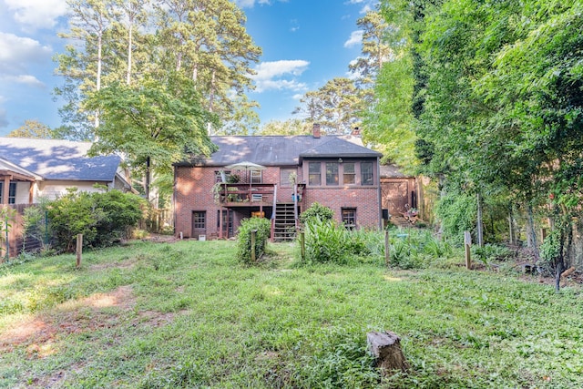 57 Patton Ct SE, Concord, NC 28025 - rear view of property with brick siding, stairway, a wooden deck, and a chimney