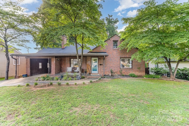 57 Patton Ct SE, Concord, NC 28025 - view of front of house with brick siding, a front yard, concrete driveway, and a chimney
