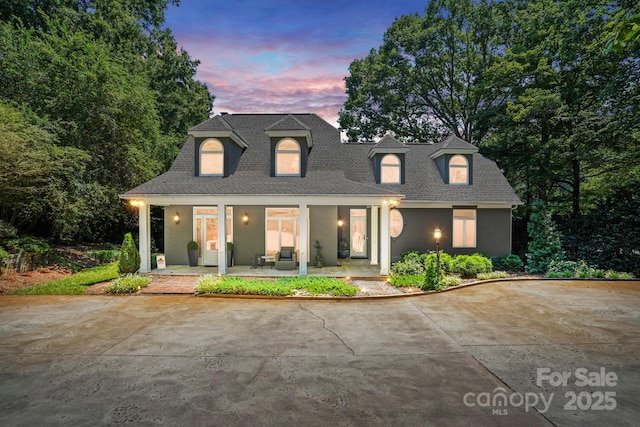 7040 Hyde St, Sherrills Ford, NC 28673 - cape cod home with a porch, a shingled roof, and stucco siding