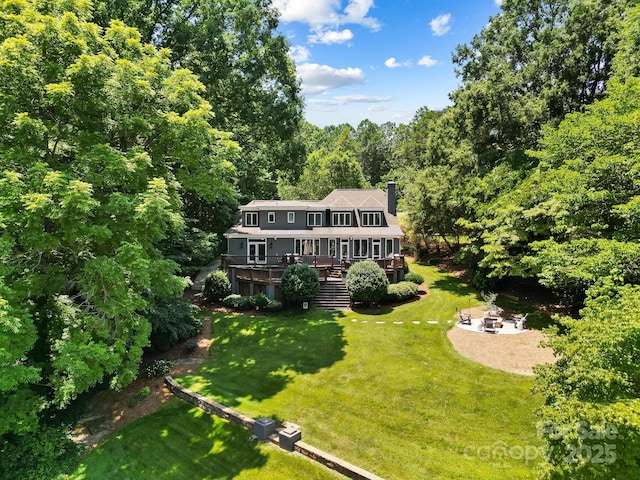 7040 Hyde St, Sherrills Ford, NC 28673 - view of front of home featuring an outdoor fire pit, stairway, a wooden deck, a chimney, and a view of trees