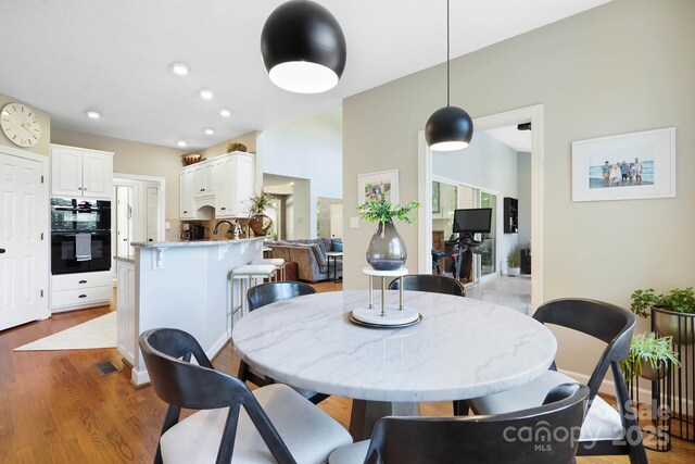 7040 Hyde St, Sherrills Ford, NC 28673 - dining area featuring wood finished floors and recessed lighting