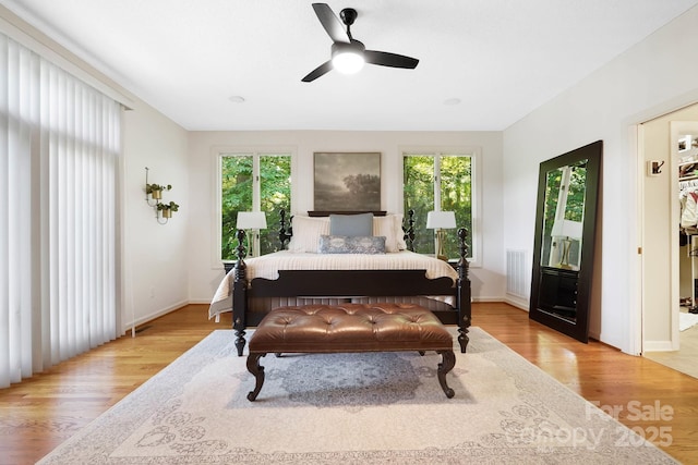 7040 Hyde St, Sherrills Ford, NC 28673 - bedroom with multiple windows, light wood-type flooring, and a ceiling fan