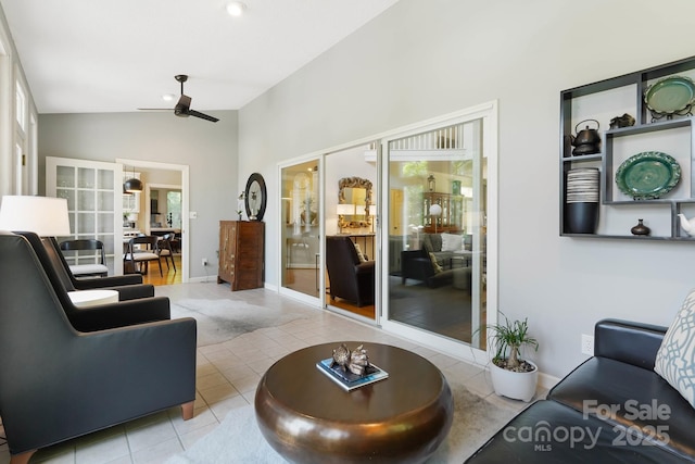 7040 Hyde St, Sherrills Ford, NC 28673 - living area with ceiling fan, light tile patterned floors, healthy amount of natural light, and vaulted ceiling