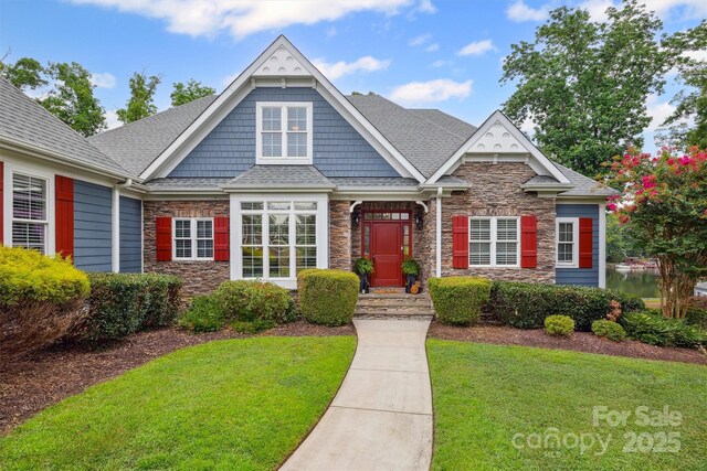 835 Misty Arbor Frd Unit 76, Clover, SC 29710 - craftsman inspired home with stone siding, a front lawn, and roof with shingles