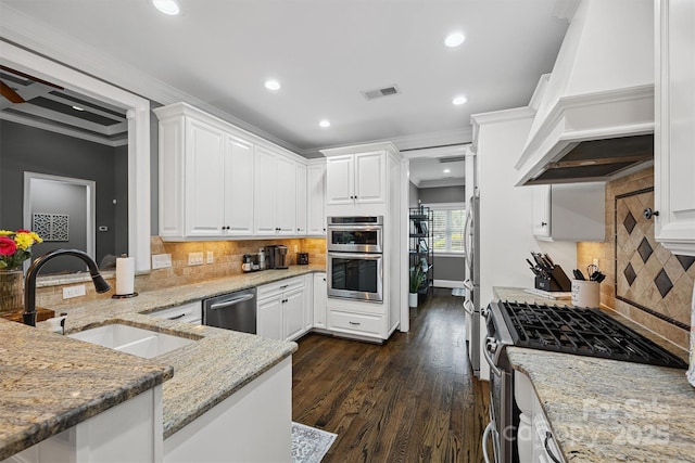 835 Misty Arbor Frd Unit 76, Clover, SC 29710 - kitchen featuring appliances with stainless steel finishes, custom range hood, ornamental molding, white cabinets, and recessed lighting
