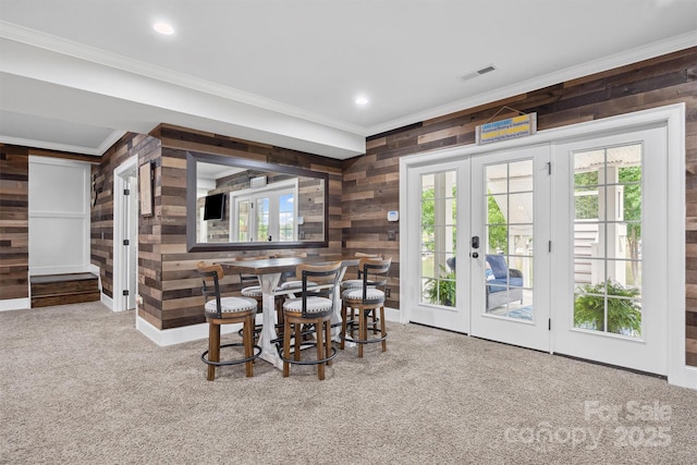 835 Misty Arbor Frd Unit 76, Clover, SC 29710 - dining space featuring wooden walls, ornamental molding, carpet floors, plenty of natural light, and french doors