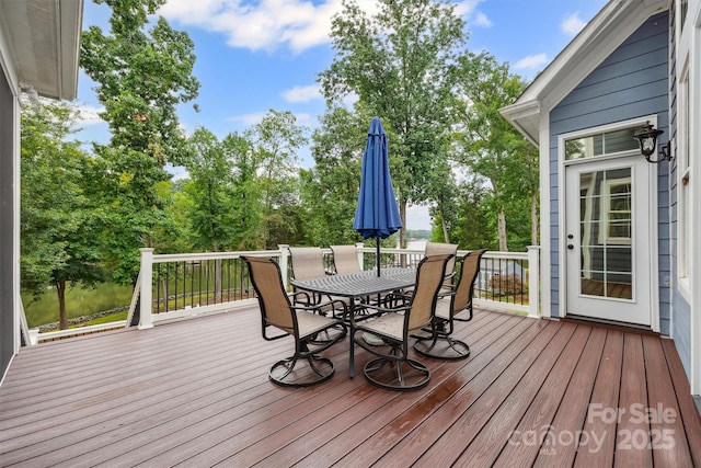 835 Misty Arbor Frd Unit 76, Clover, SC 29710 - deck with outdoor dining space and view of wooded area