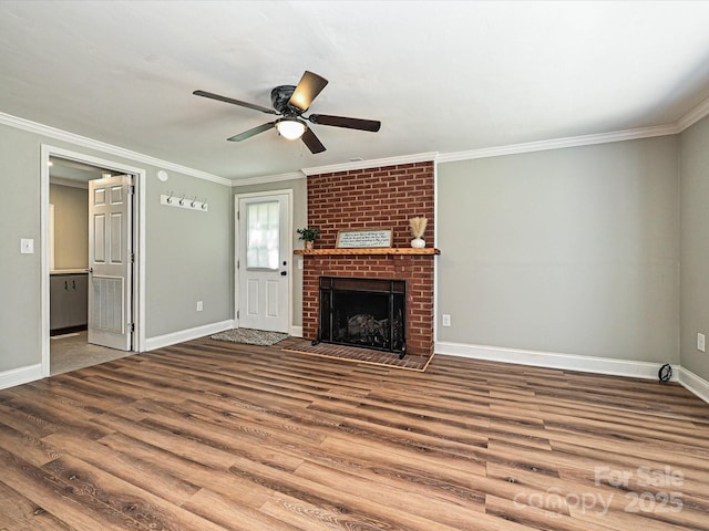 159 Valleydale Dr, Gastonia, NC 28056 - unfurnished living room featuring wood finished floors, ornamental molding, ceiling fan, and a brick fireplace