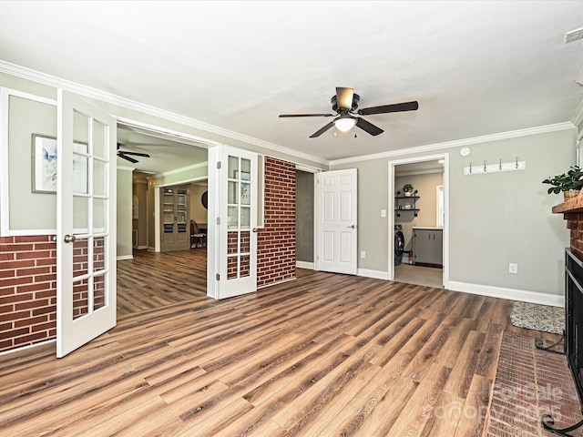 159 Valleydale Dr, Gastonia, NC 28056 - unfurnished living room featuring ceiling fan, a brick fireplace, wood finished floors, french doors, and crown molding