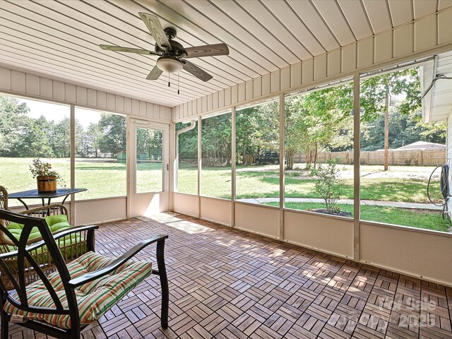 159 Valleydale Dr, Gastonia, NC 28056 - unfurnished sunroom with a ceiling fan and view of scattered trees