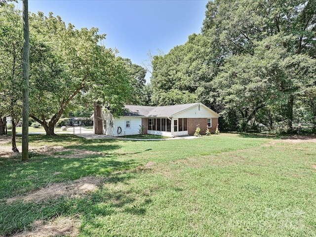 159 Valleydale Dr, Gastonia, NC 28056 - view of front of home with a front lawn, a sunroom, and brick siding