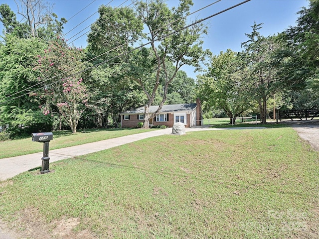159 Valleydale Dr, Gastonia, NC 28056 - ranch-style home with a front lawn, a chimney, and driveway