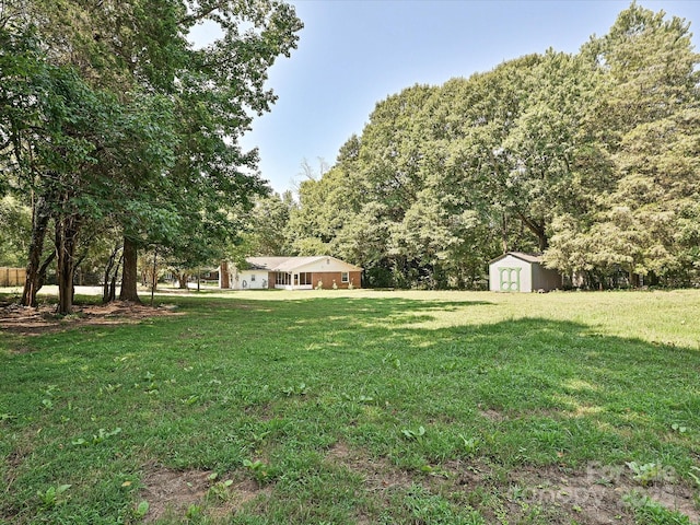 159 Valleydale Dr, Gastonia, NC 28056 - view of green lawn featuring a storage shed