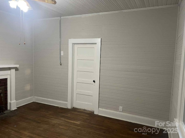 325 N Caldwell Ave, Newton, NC 28658 - unfurnished living room featuring dark wood-style floors, crown molding, a fireplace, and ceiling fan