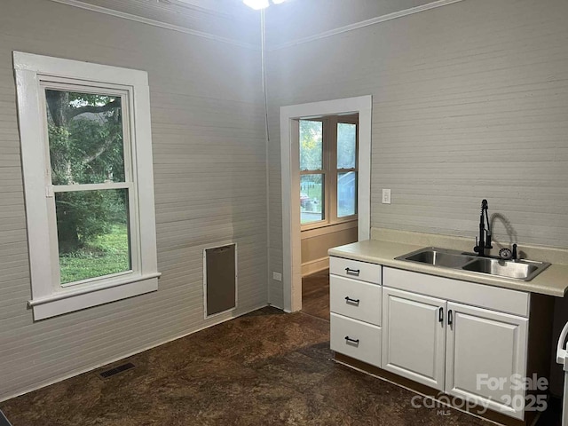 325 N Caldwell Ave, Newton, NC 28658 - kitchen featuring white cabinets, healthy amount of natural light, light countertops, and crown molding