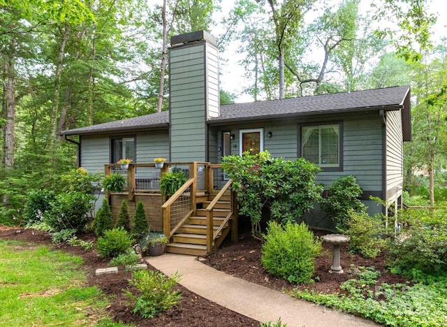 14 New Bern Dr, Fletcher, NC 28732 - view of front facade with a chimney, a deck, stairway, and a shingled roof