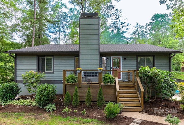 14 New Bern Dr, Fletcher, NC 28732 - view of front facade featuring a deck, a chimney, stairs, and a shingled roof