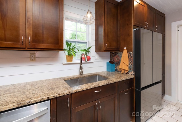14 New Bern Dr, Fletcher, NC 28732 - kitchen with stainless steel appliances, light stone countertops, dark brown cabinets, and light tile patterned floors