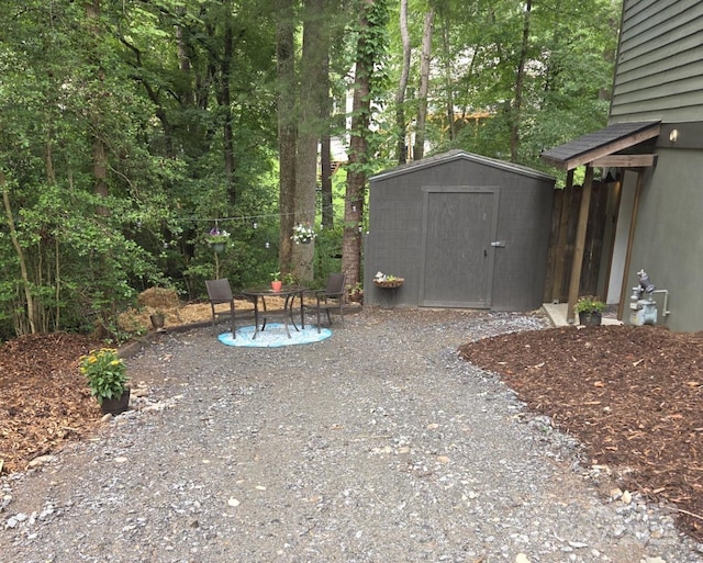 14 New Bern Dr, Fletcher, NC 28732 - view of yard featuring a storage unit and a patio area