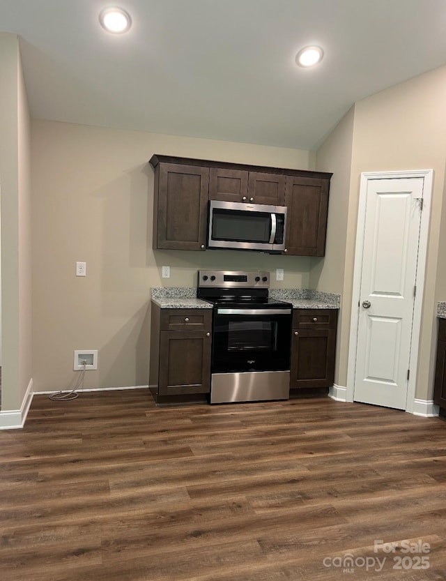 32967 Poplar Lane Rd, Albemarle, NC 28001 - kitchen with stainless steel appliances, dark brown cabinets, dark wood-style flooring, recessed lighting, and light stone counters