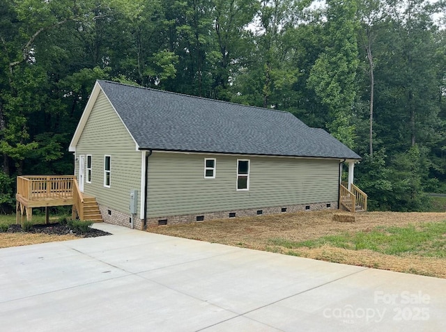 32967 Poplar Lane Rd, Albemarle, NC 28001 - view of side of home featuring crawl space, a shingled roof, a wooden deck, and a forest view