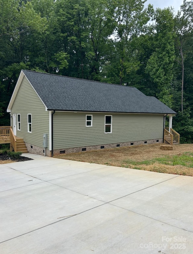 32967 Poplar Lane Rd, Albemarle, NC 28001 - view of property exterior featuring crawl space, roof with shingles, and concrete driveway