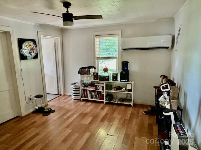 39 Hemphill Rd, Waynesville, NC 28785 - miscellaneous room featuring a wall mounted AC, ceiling fan, ornamental molding, and wood finished floors