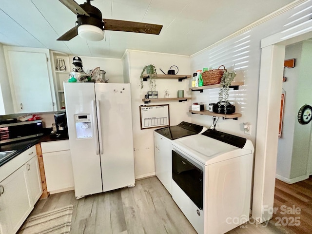 39 Hemphill Rd, Waynesville, NC 28785 - kitchen featuring white fridge with ice dispenser, washer and clothes dryer, open shelves, and light wood-type flooring
