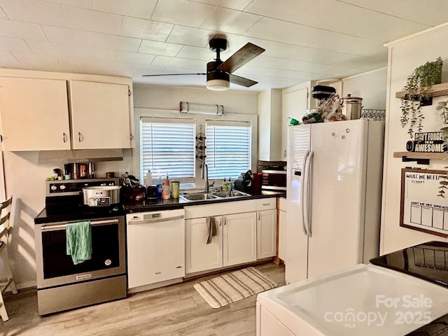 39 Hemphill Rd, Waynesville, NC 28785 - kitchen with white appliances, a ceiling fan, white cabinets, light wood finished floors, and crown molding