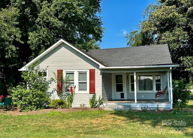 39 Hemphill Rd, Waynesville, NC 28785 - bungalow-style house with covered porch, a front yard, and roof with shingles