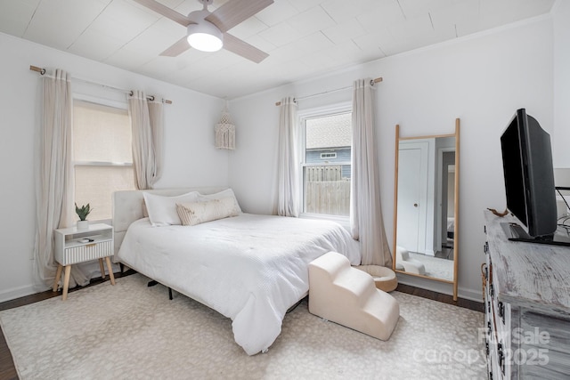 700 Perkins St, Lowell, NC 28098 - bedroom featuring wood finished floors and ceiling fan