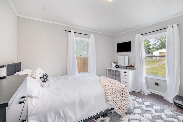 700 Perkins St, Lowell, NC 28098 - bedroom with multiple windows, wood finished floors, and crown molding