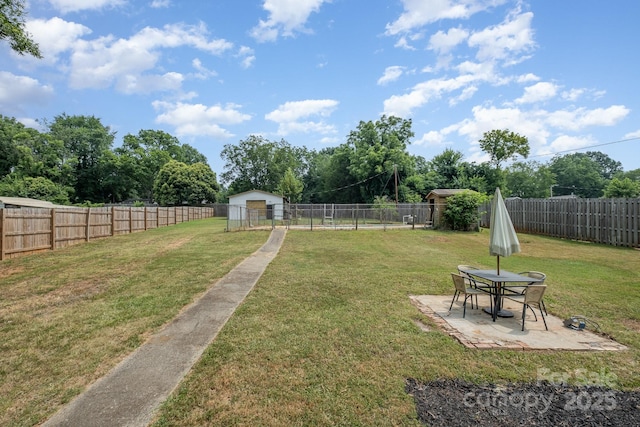 700 Perkins St, Lowell, NC 28098 - fenced backyard with a patio and view of scattered trees