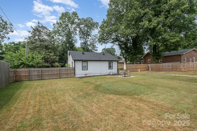 700 Perkins St, Lowell, NC 28098 - fenced backyard with a patio