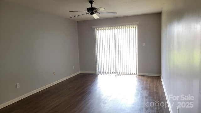 2116 S Main St, Kannapolis, NC 28081 - spare room featuring ceiling fan and dark wood-style floors