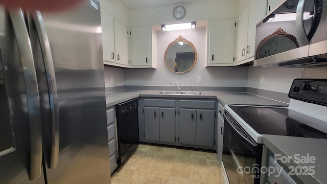 2116 S Main St, Kannapolis, NC 28081 - kitchen with black appliances, gray cabinetry, white cabinetry, and stone finish floors