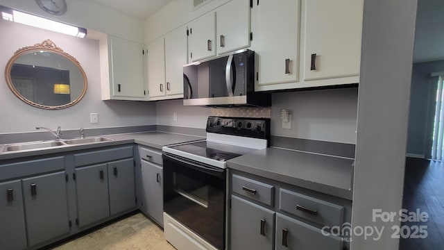 2116 S Main St, Kannapolis, NC 28081 - kitchen featuring electric range oven, black microwave, white cabinets, and gray cabinets