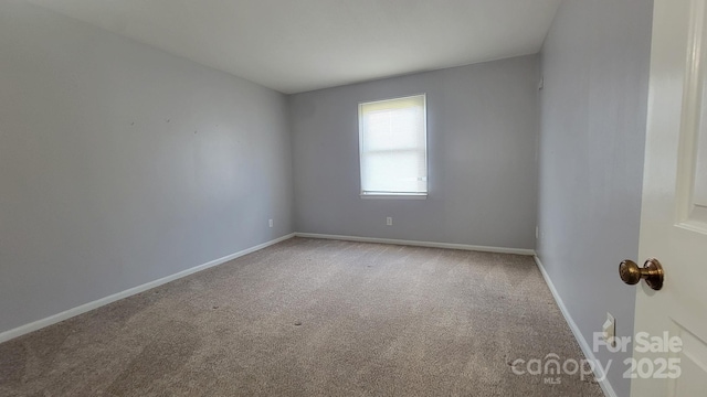 2116 S Main St, Kannapolis, NC 28081 - carpeted empty room featuring baseboards
