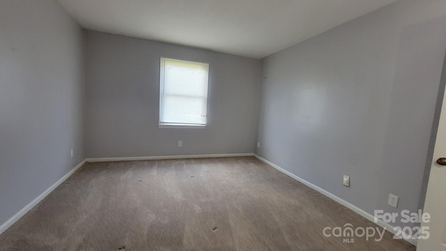 2116 S Main St, Kannapolis, NC 28081 - carpeted spare room featuring baseboards