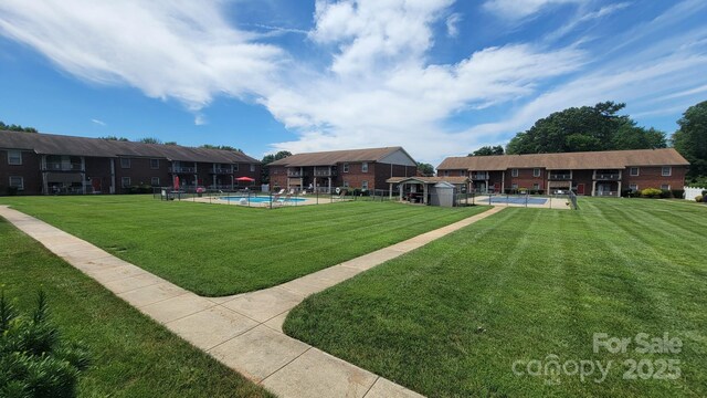 2116 S Main St, Kannapolis, NC 28081 - view of yard featuring a shed and a community pool