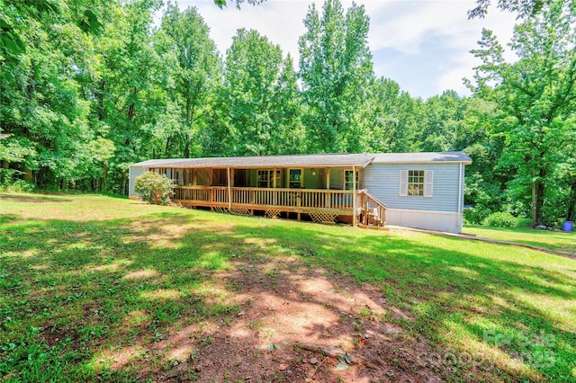 121 Whipporwill Ct, Grover, NC 28073 - view of front of home with a front yard, a wooden deck, and a view of trees