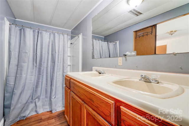 121 Whipporwill Ct, Grover, NC 28073 - full bath featuring wood finished floors, double vanity, and a shower with shower curtain
