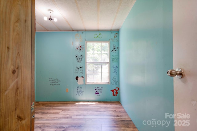 121 Whipporwill Ct, Grover, NC 28073 - empty room featuring wood finished floors and a textured ceiling