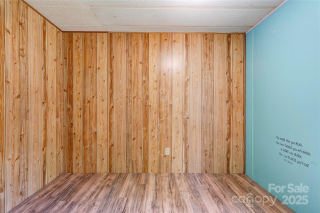 121 Whipporwill Ct, Grover, NC 28073 - empty room with wood finished floors and wooden walls