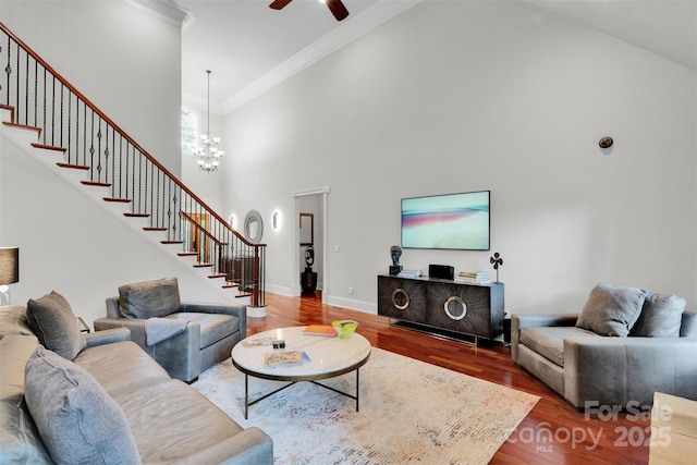 4552 Sawgrass Ct, Denver, NC 28037 - living room featuring high vaulted ceiling, stairway, wood finished floors, a ceiling fan, and ornamental molding
