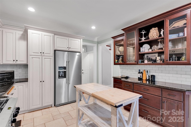 4552 Sawgrass Ct, Denver, NC 28037 - kitchen with high quality fridge, glass insert cabinets, backsplash, range with gas cooktop, and white cabinetry