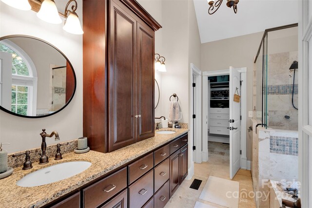 4552 Sawgrass Ct, Denver, NC 28037 - full bathroom with a stall shower, double vanity, a walk in closet, and lofted ceiling