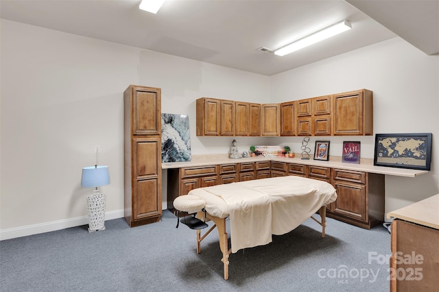 4552 Sawgrass Ct, Denver, NC 28037 - kitchen featuring brown cabinets, carpet, light countertops, and built in study area