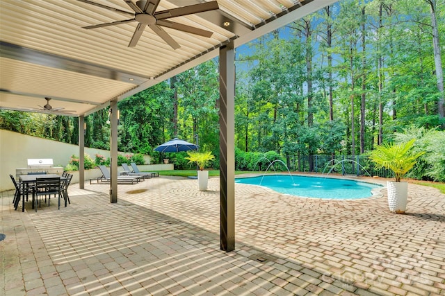 4552 Sawgrass Ct, Denver, NC 28037 - outdoor pool with a ceiling fan, a fenced backyard, outdoor dining space, a patio area, and view of wooded area