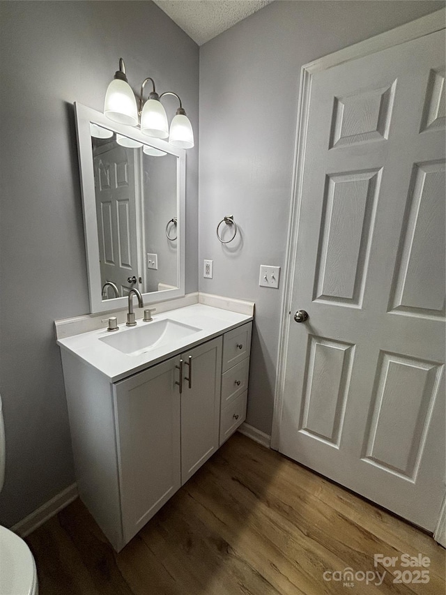 39 Moondust Dr, Waynesville, NC 28786 - bathroom with vanity, wood finished floors, and a textured ceiling